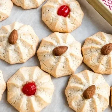 Homemade amaretti cookies displayed on a rustic wooden table