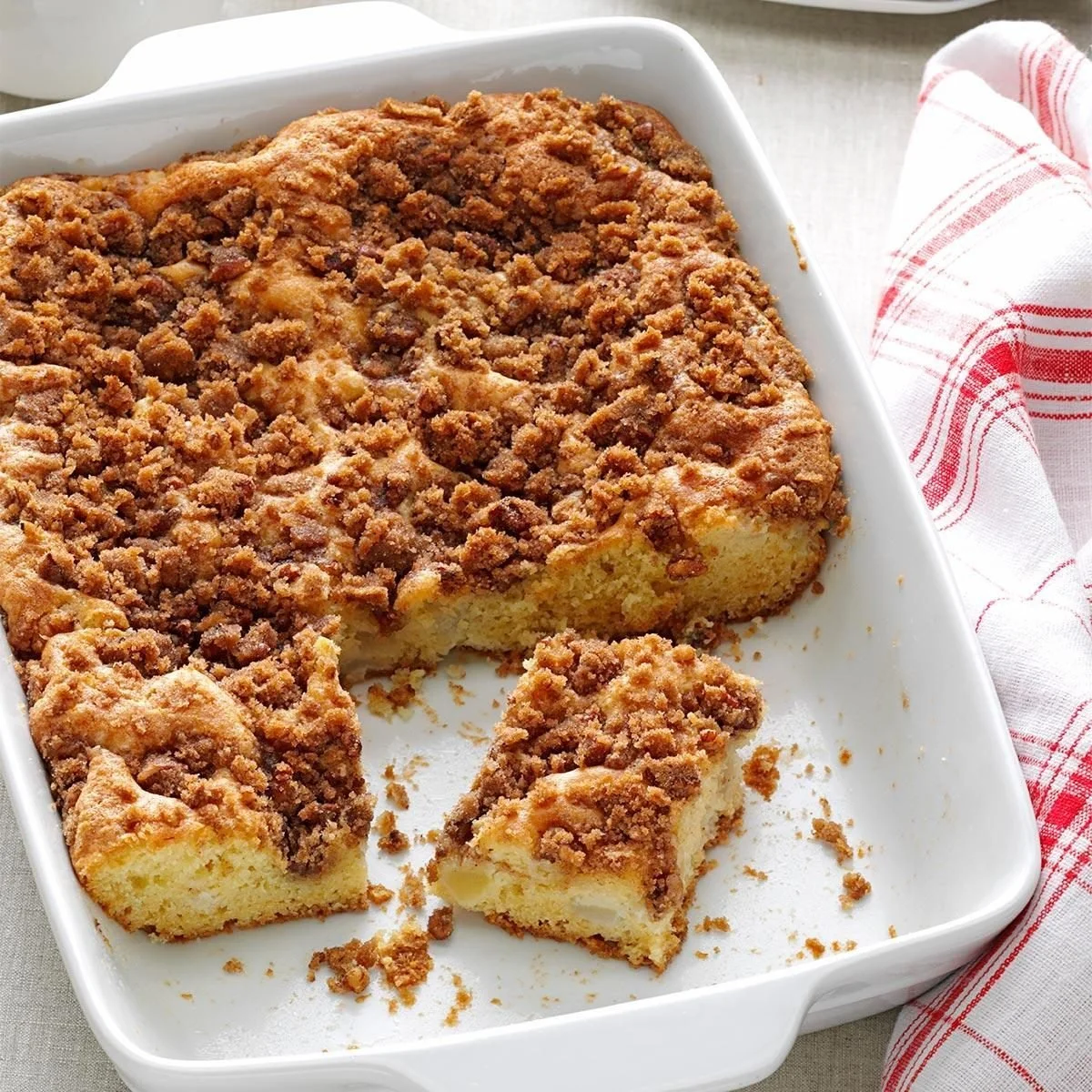 Delicious Apple Pear Coffee Cake served on a plate with a cinnamon sprinkle
