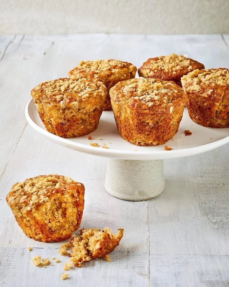 Delicious banana apple crumble muffins with a crunchy topping and fresh fruit.