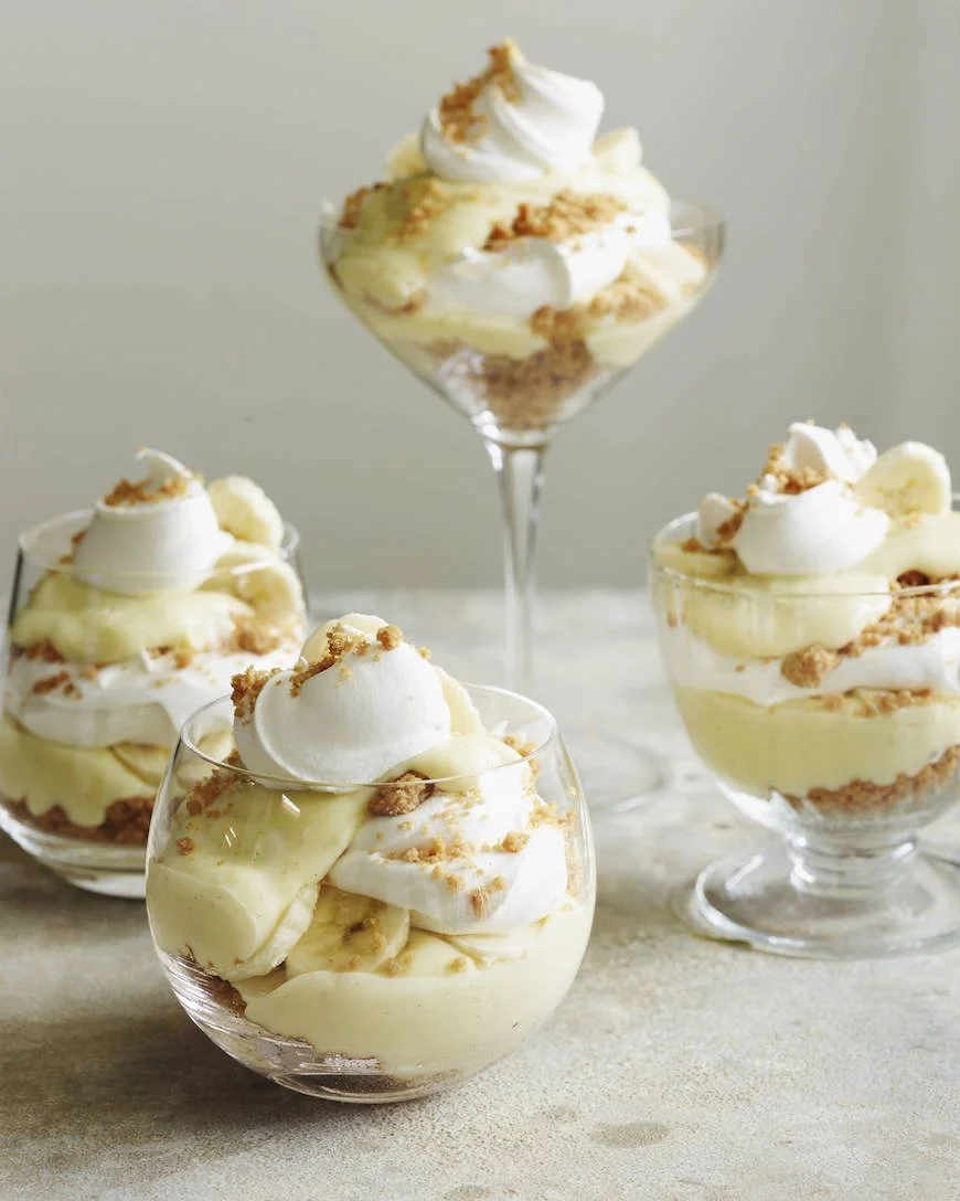 Layered Banana Cream Pie Parfaits served in a clear glass dish