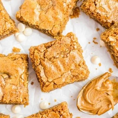 Decadent Biscoff brownies topped with cookie spread and chocolate drizzle.