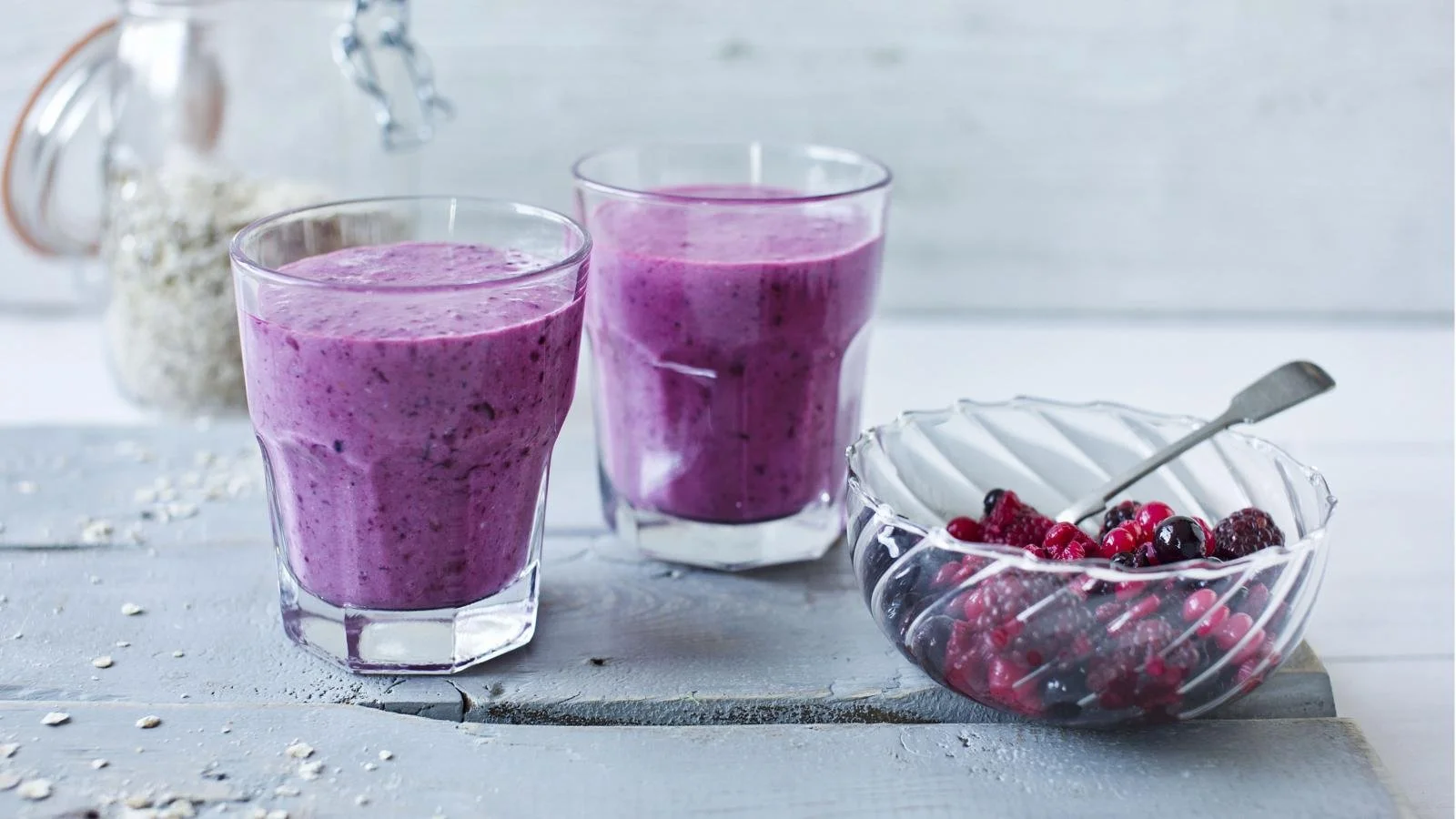 Delicious blackberry apple crumble smoothie in a glass with crumble topping