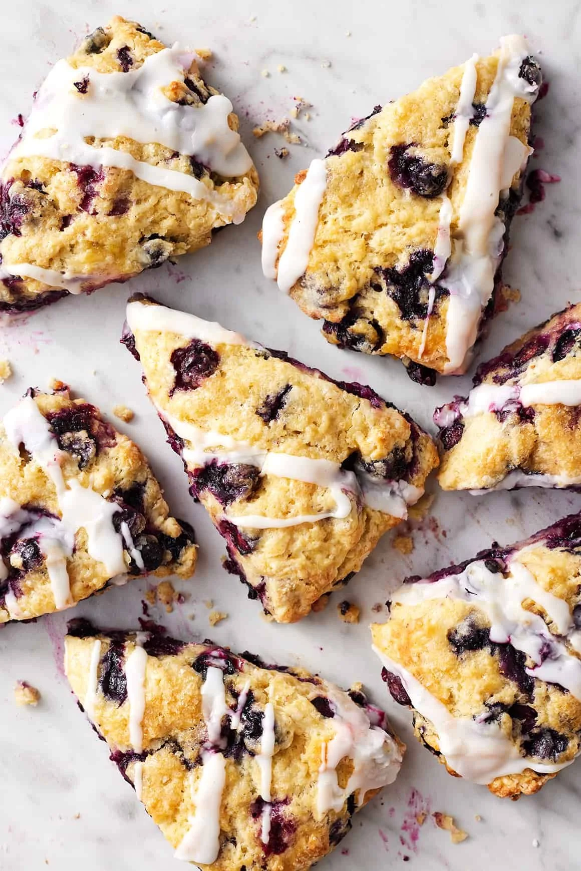 Freshly baked blueberry scones on a cooling rack