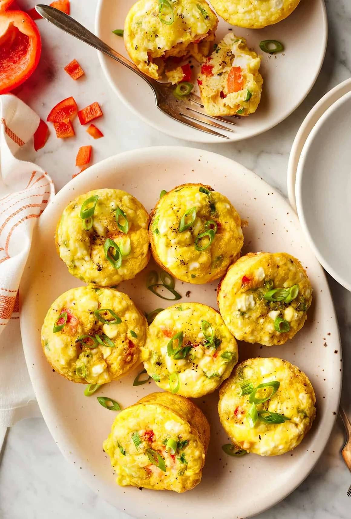 Freshly baked breakfast egg muffins with vegetables and cheese