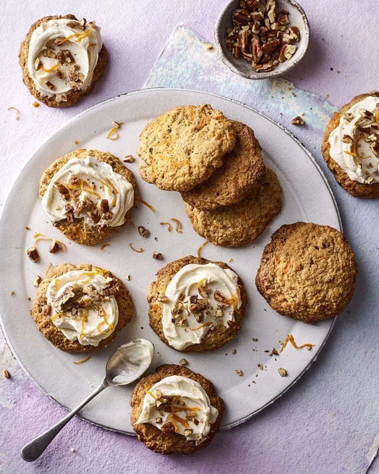 Freshly baked carrot cake cookies on a cooling rack