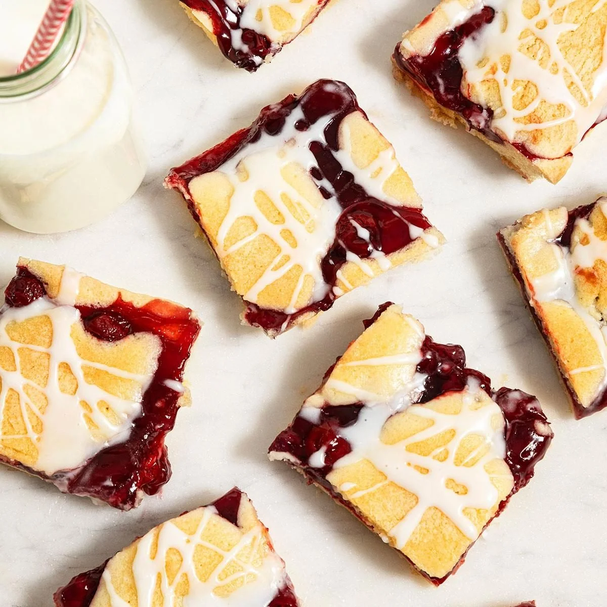 Delicious homemade cherry pie bars topped with fresh cherries and crust