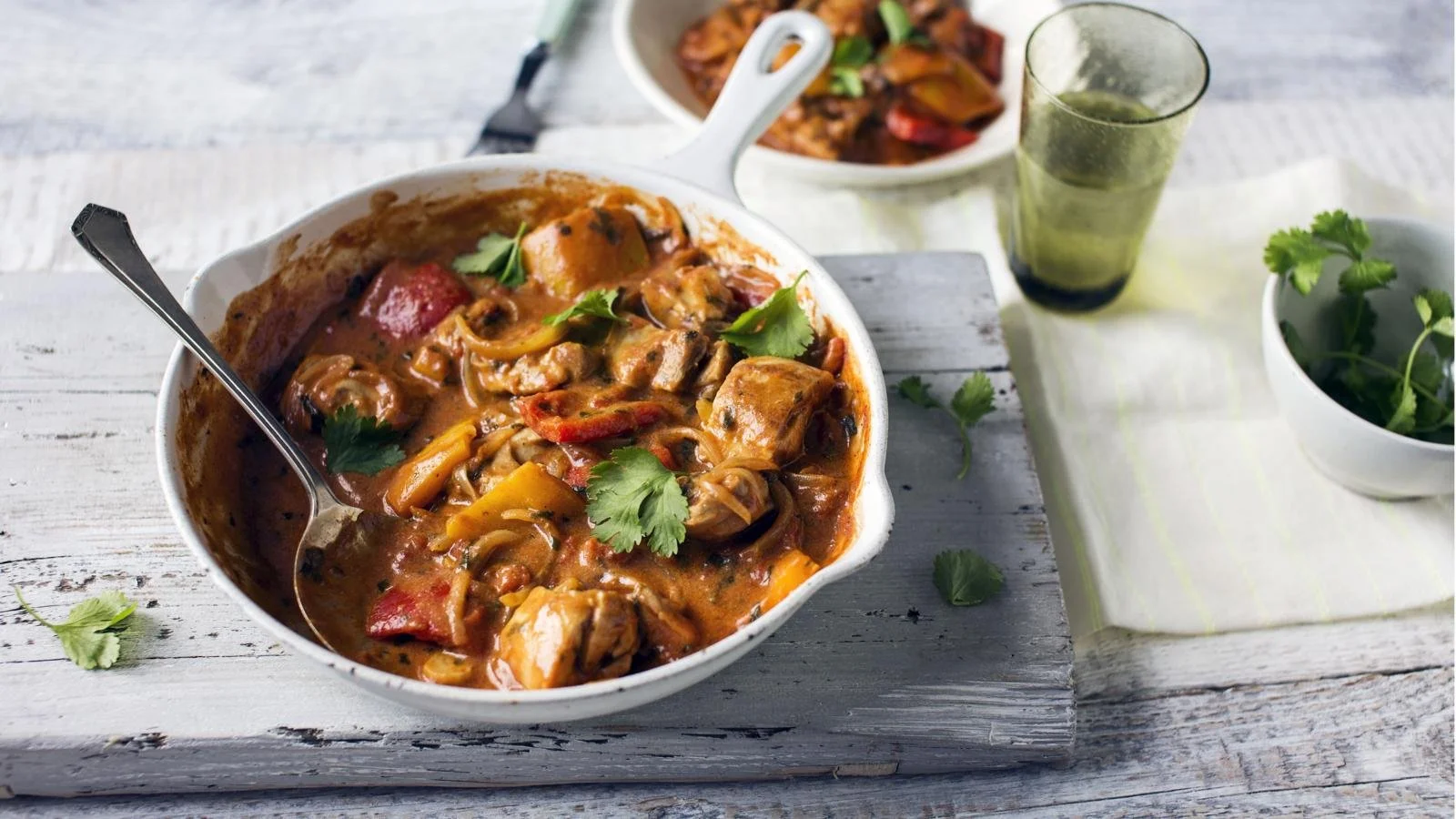 A delicious Chicken and Vegetable Balti dish served in a traditional curry bowl.
