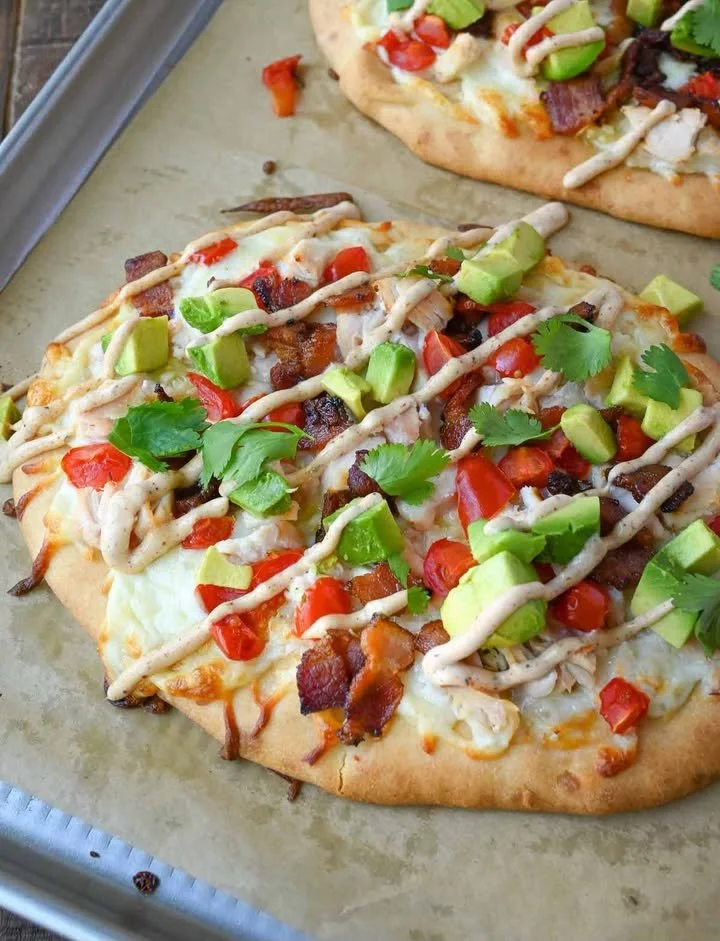 Delicious Chicken Club Flatbread with grilled chicken, bacon, and fresh vegetables.