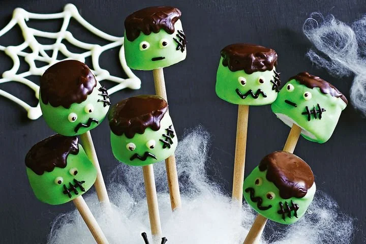 Chocolate marshmallow pops on a decorative plate