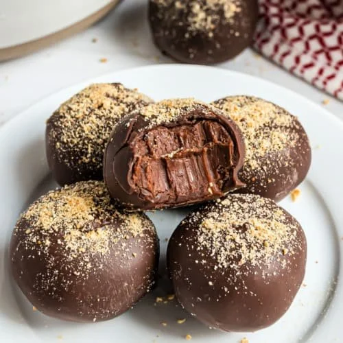 Delicious homemade chocolate truffles displayed on a elegant plate