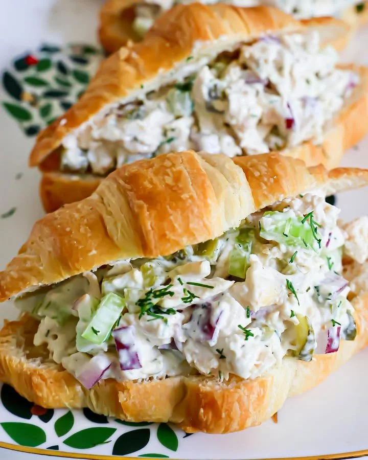 Delicious Dill Pickle Chicken Salad in a bowl, garnished with fresh herbs