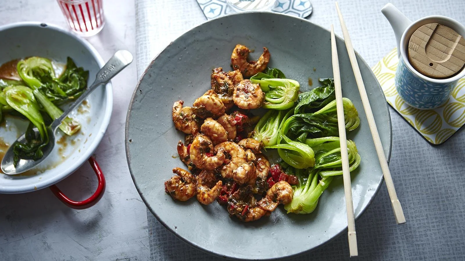 Plate of spicy firecracker prawns garnished with herbs