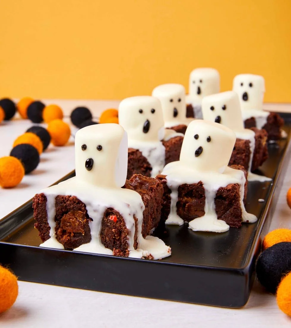 Delicious Ghost Marshmallow Brownies with spooky marshmallow topping.