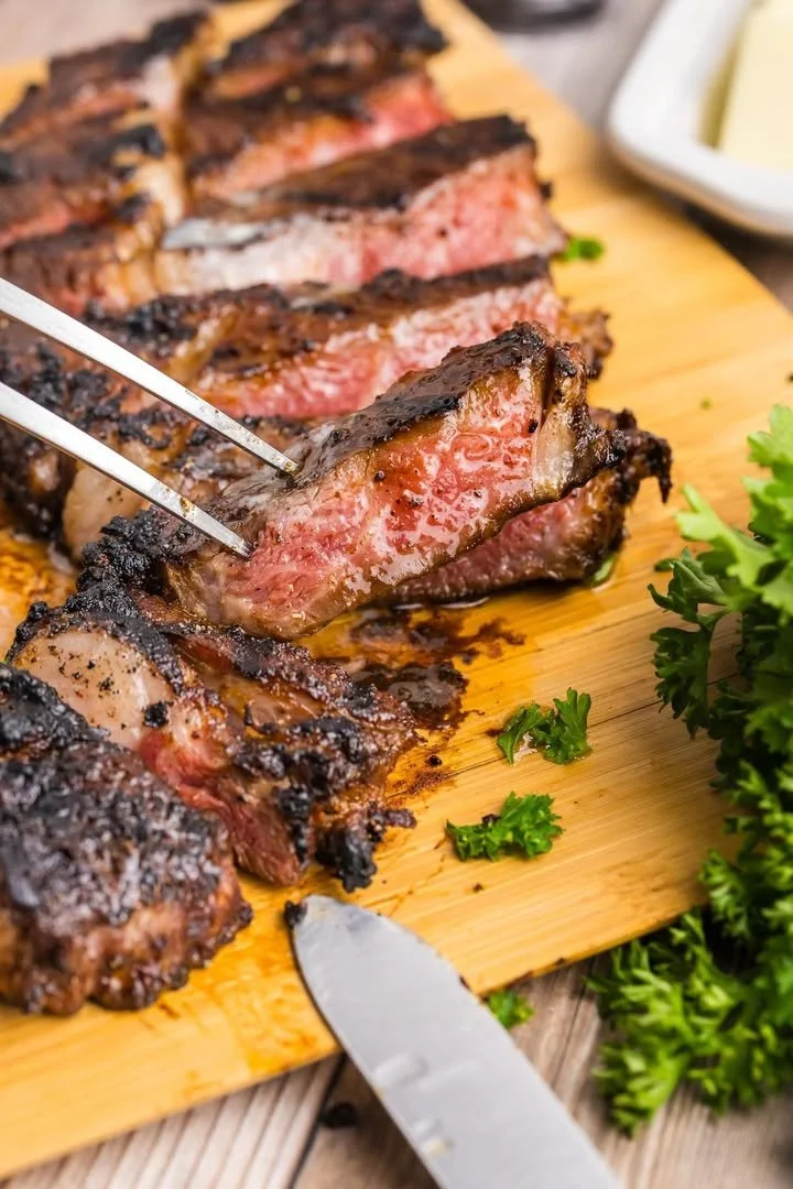 Delicious grilled rib eye steak served with sides