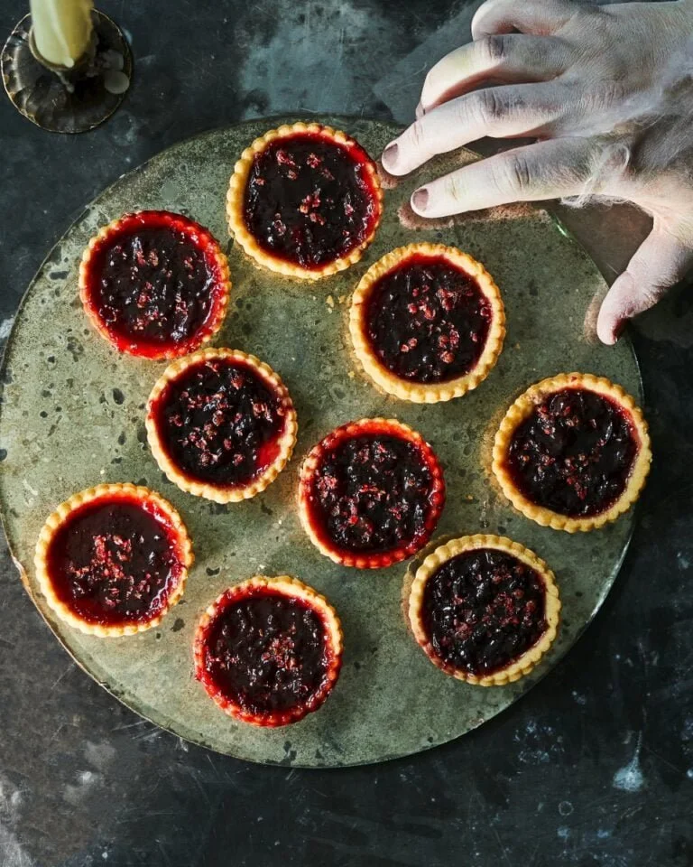 Halloween Black Cherry Jam Tarts topped with spooky decorations