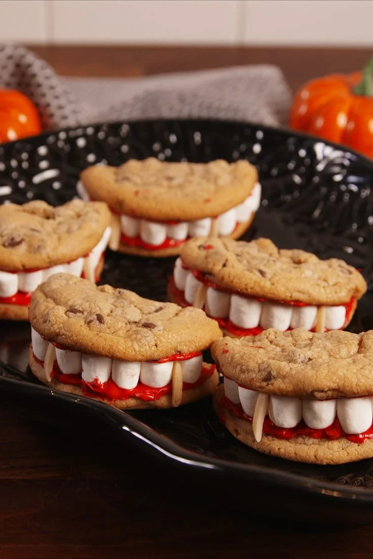 Halloween vampire cookies decorated with fangs and red icing