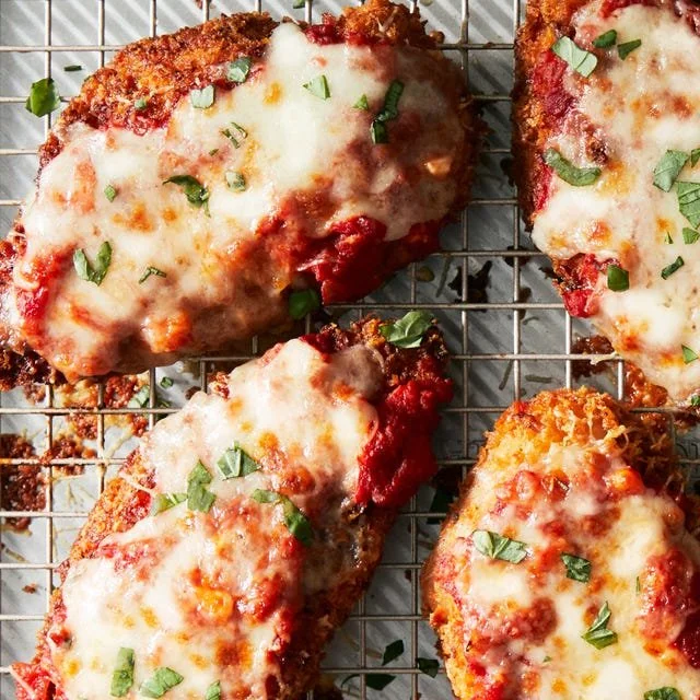 Delicious homemade Chicken Parmesan with melted cheese and marinara sauce.