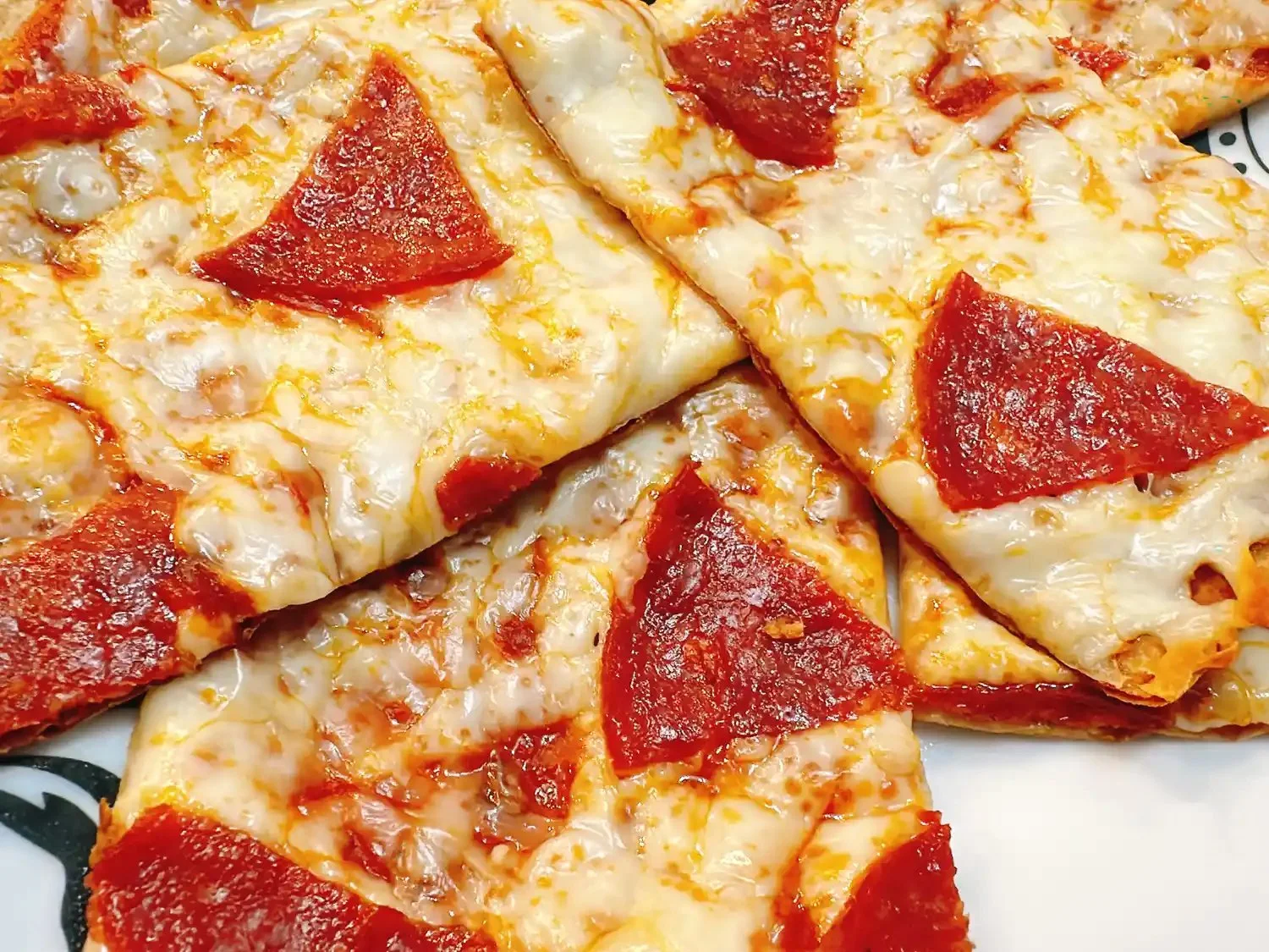 Delicious lavash pizza topped with fresh vegetables and cheese.