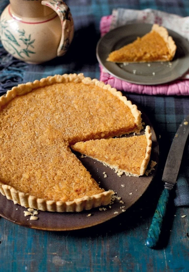 Delicious homemade make-ahead treacle tart served on a dessert plate