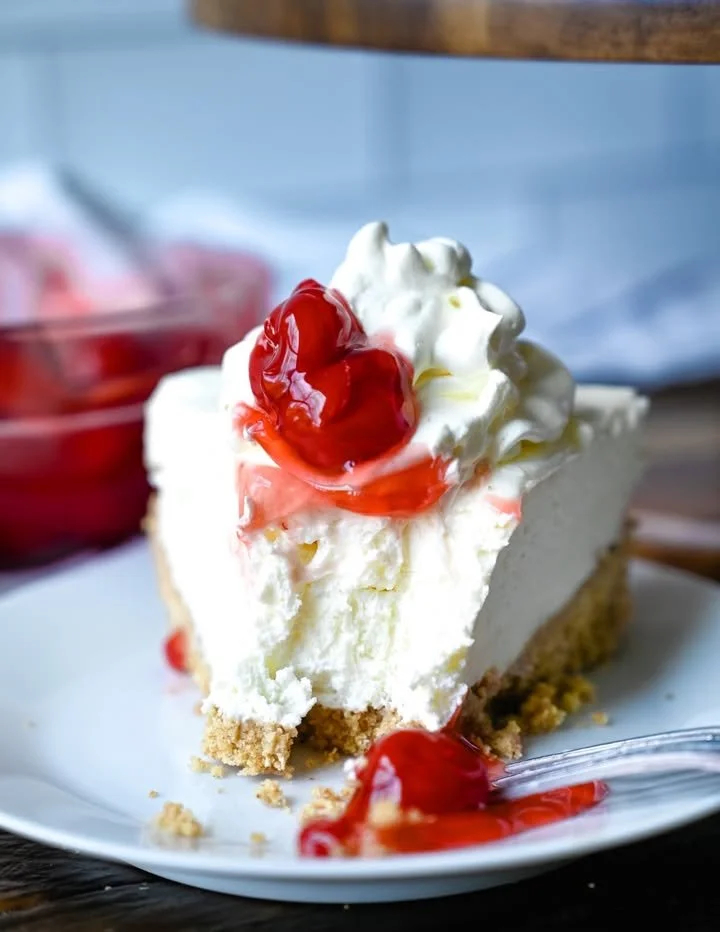 Delicious no-bake cherry cheesecake topped with fresh cherries