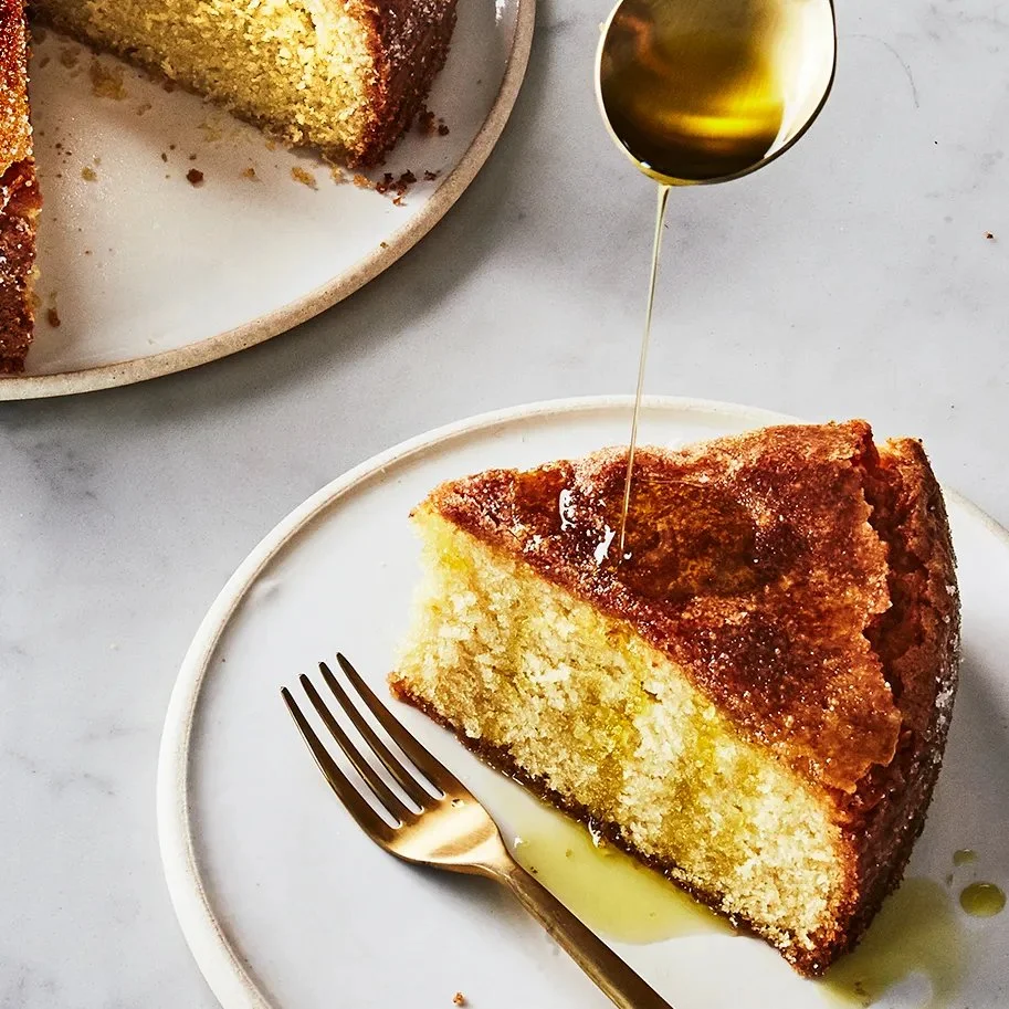 Delicious homemade olive oil cake with a golden crust and fresh citrus garnish