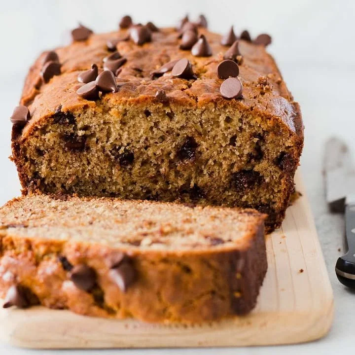 Peanut Butter Chocolate Chip Banana Bread sliced and served on a plate.