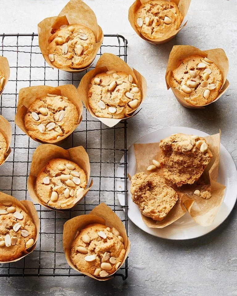 Freshly baked peanut butter muffins on a cooling rack