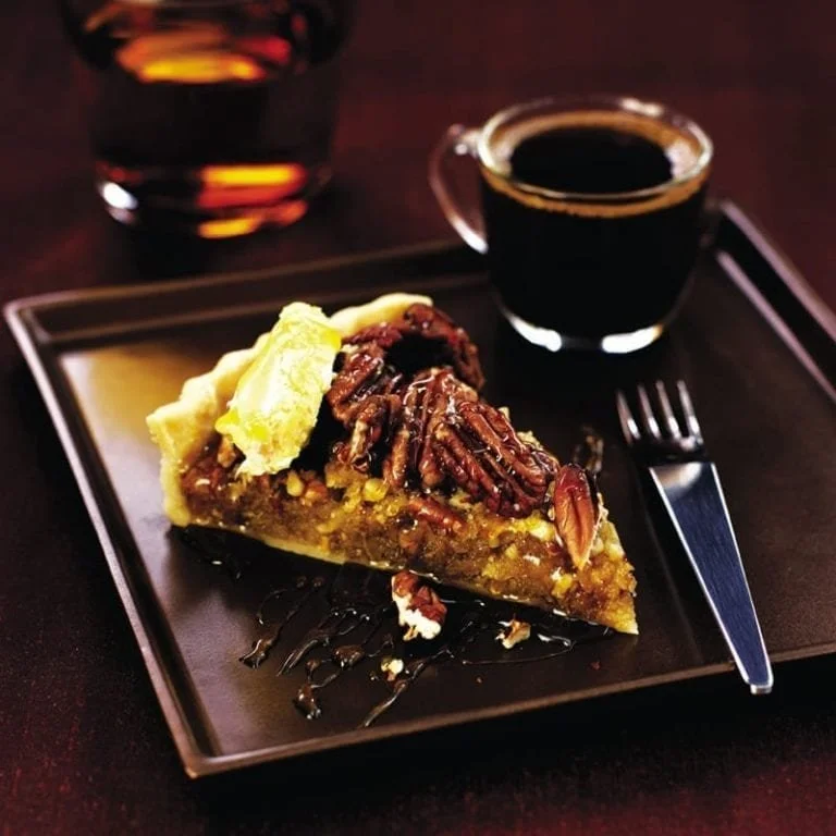 Delicious Pecan Treacle Tart with rich pecans and golden syrup filling.