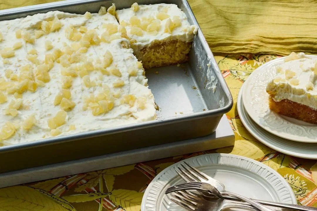 Delicious homemade pineapple cake with fresh slices and cream frosting