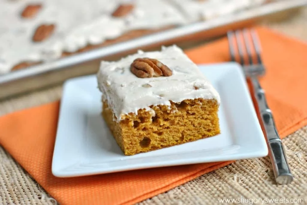 Delicious pumpkin bars topped with creamy frosting and sprinkled with pecans