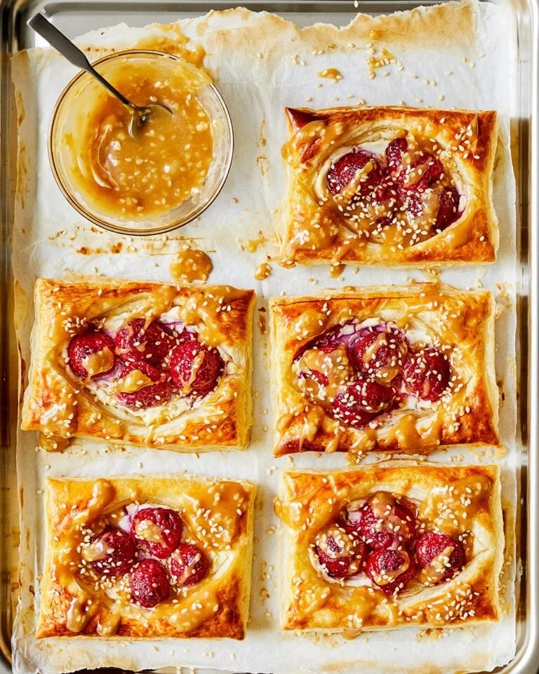 Raspberry Cheesecake Danishes with sesame topping, a delicious pastry treat.