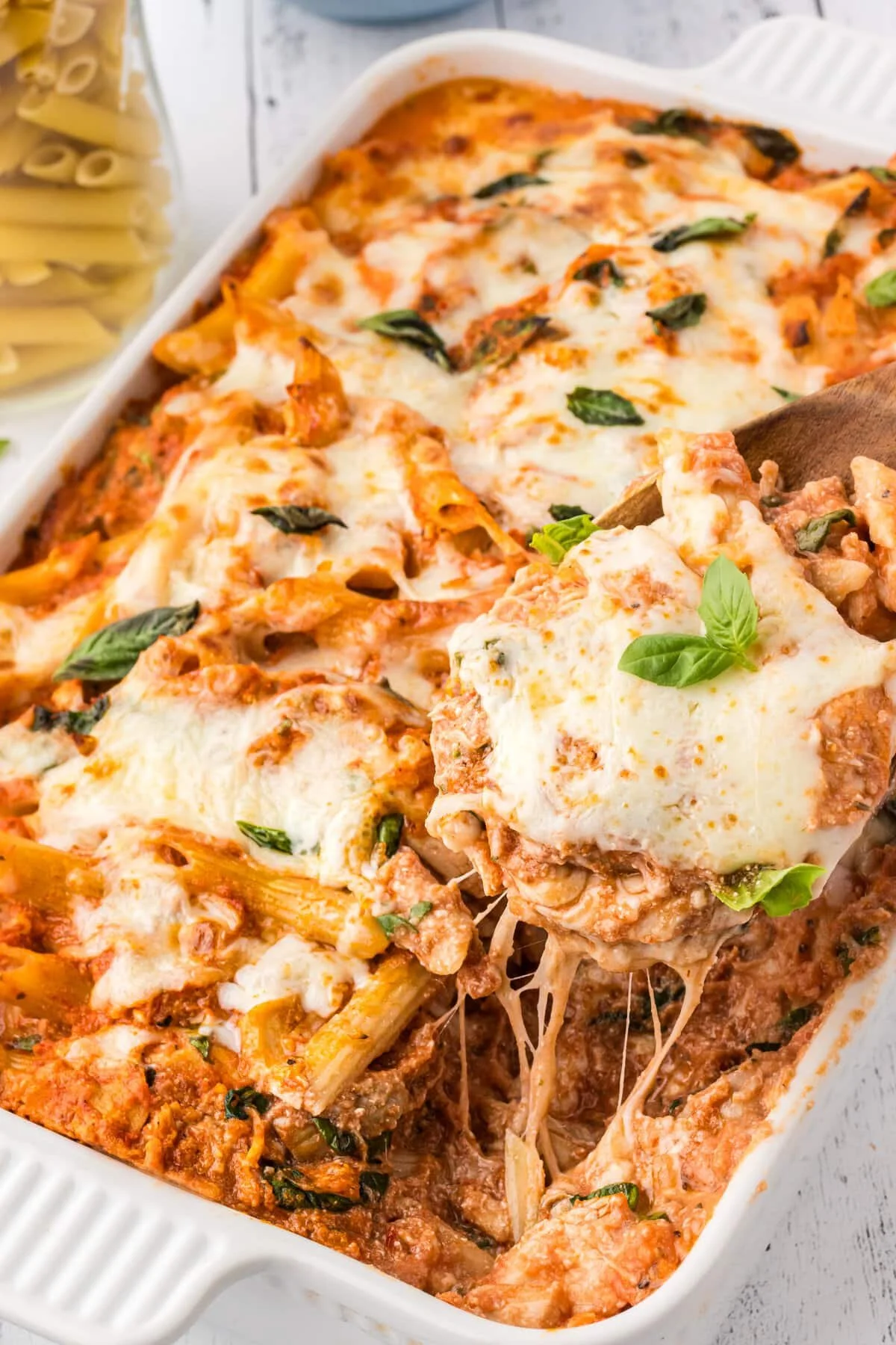 Delicious ricotta chicken casserole topped with herbs and cheese