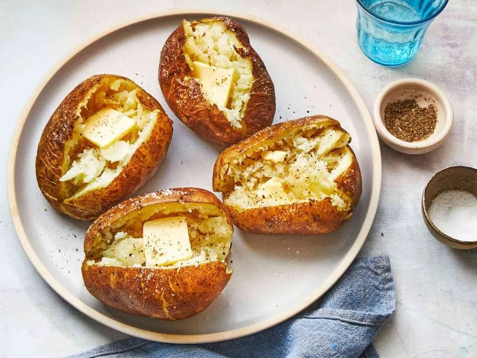 Variety of baking potatoes including Russets, perfect for delicious baked dishes.