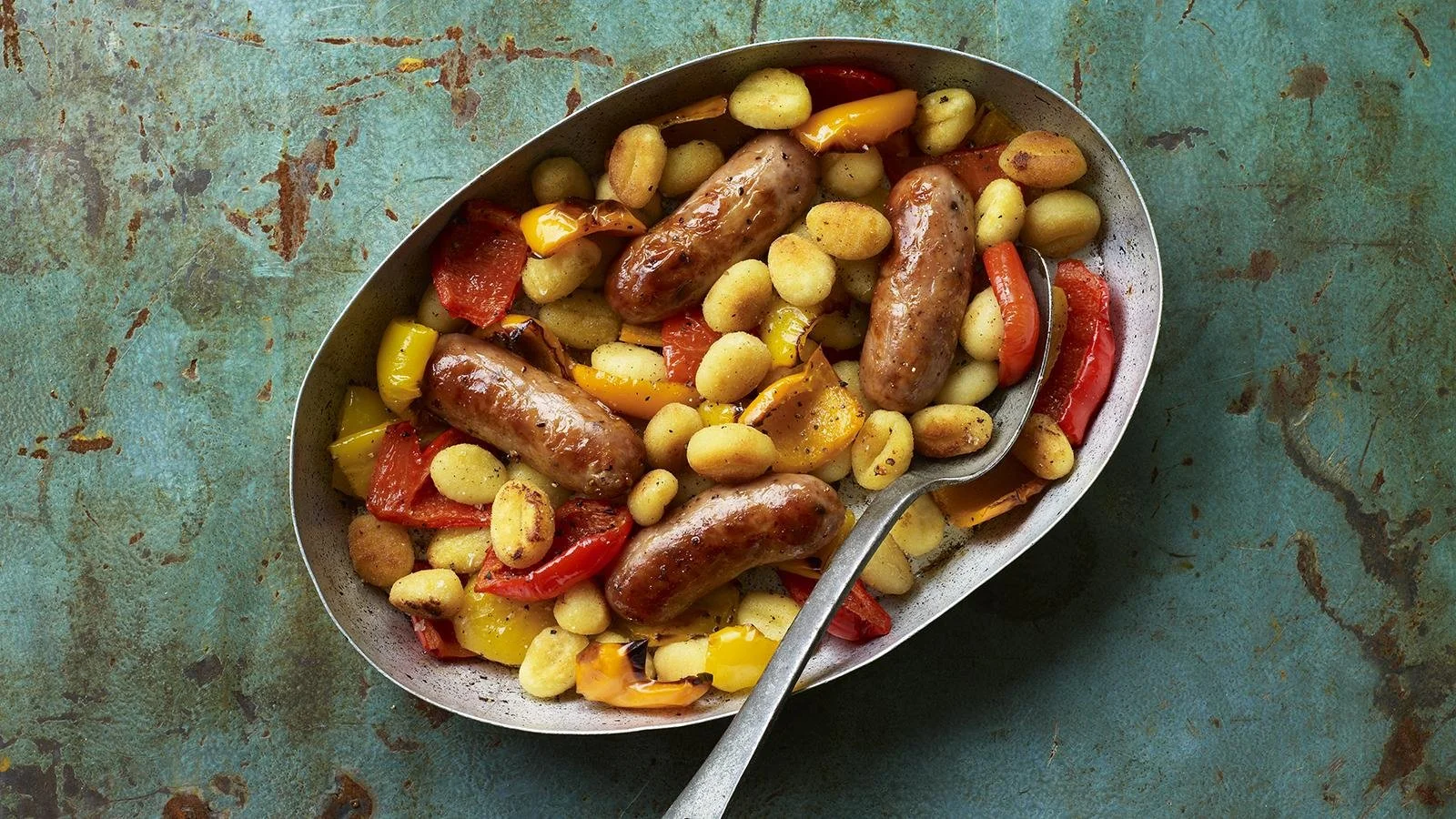 Delicious sausage bake with vegetables in a baking dish