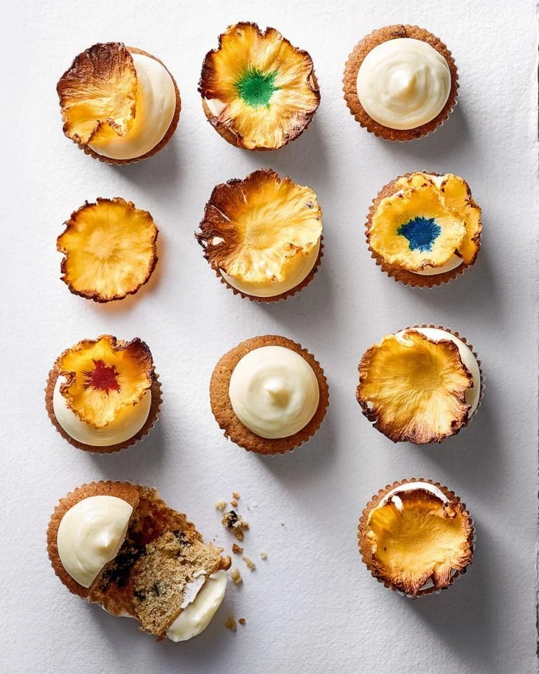 Spiced muffins topped with pineapple flowers for a tropical flavor.