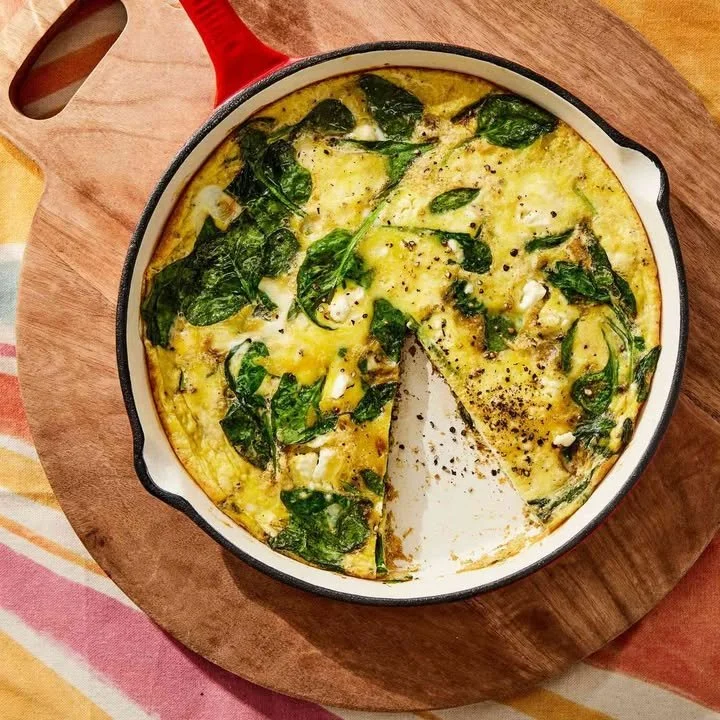 Spinach and Egg Frittata served with fresh herbs on a plate