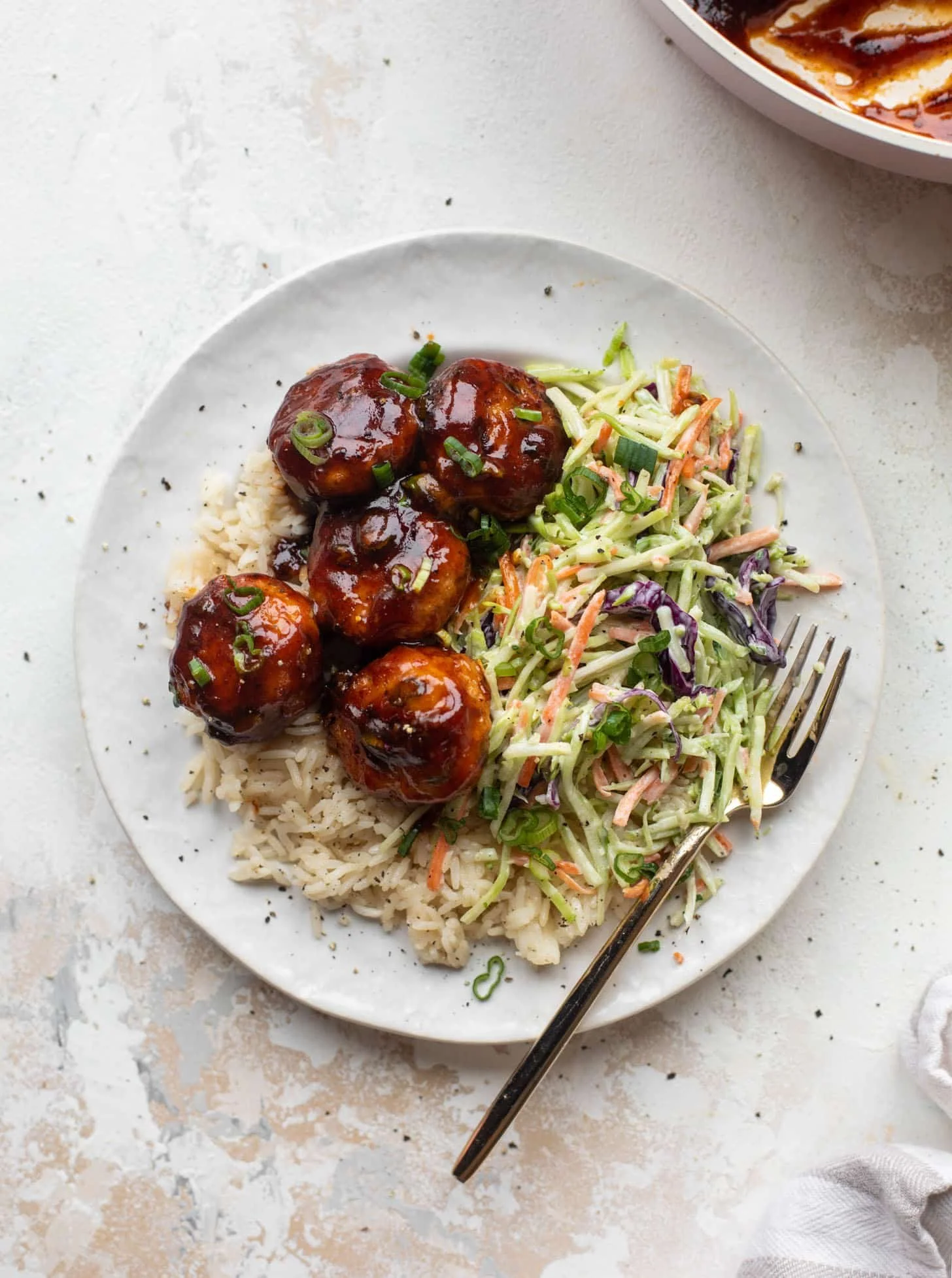 Sticky BBQ Chicken Meatballs served with fresh broccoli slaw