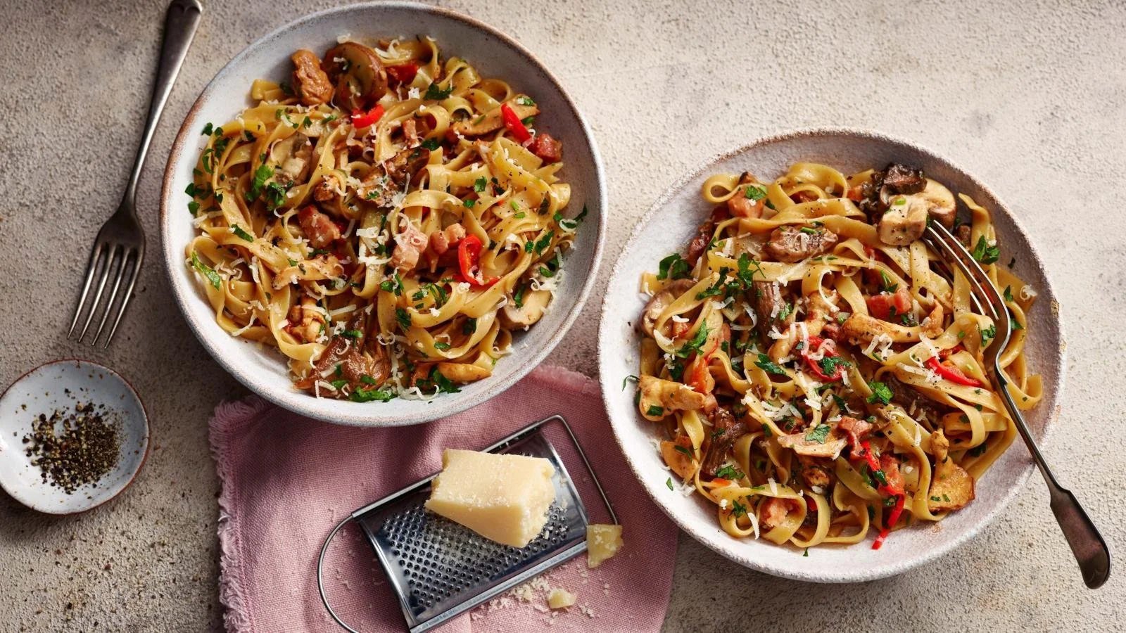 Tagliatelle pasta topped with mushroom and pancetta sauce for a gourmet meal