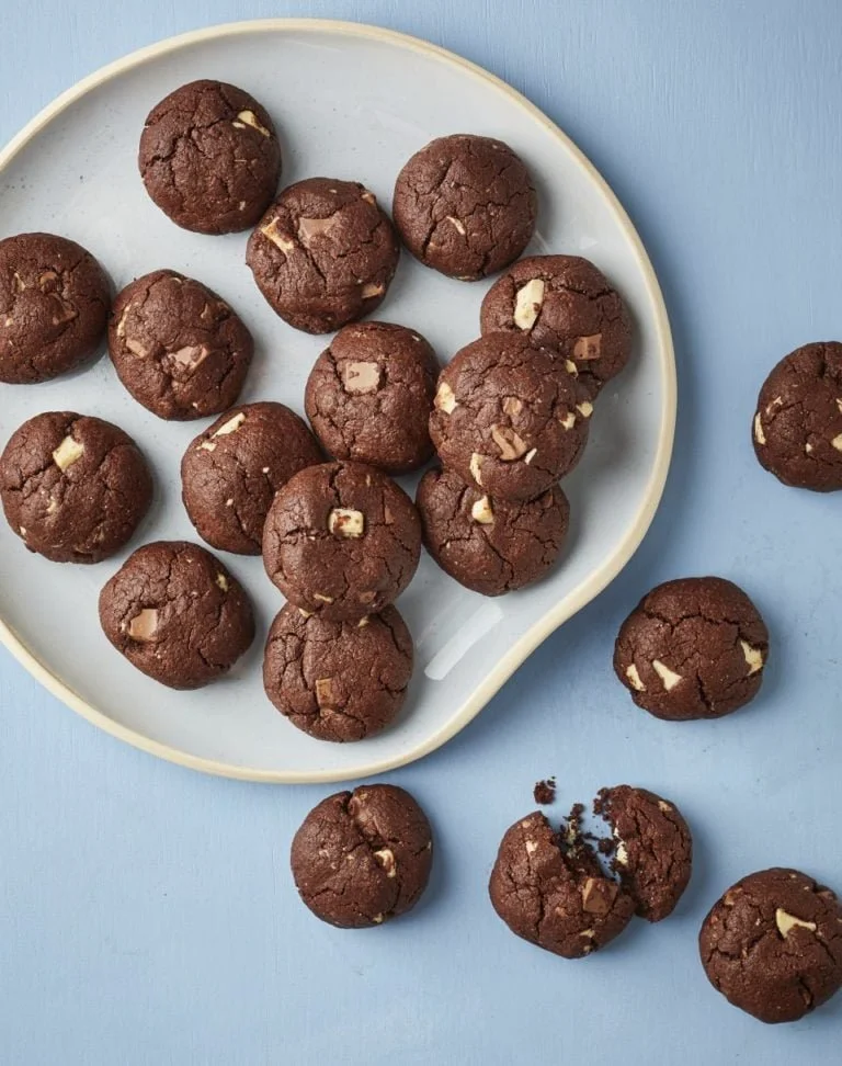 Triple Chocolate Rye Cookies stacked on a plate, showcasing rich chocolate layers