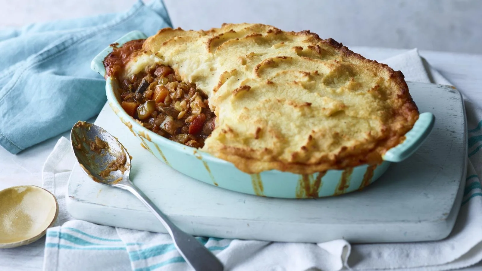 Delicious Vegan Shepherd's Pie topped with creamy mashed potatoes and colorful veggies