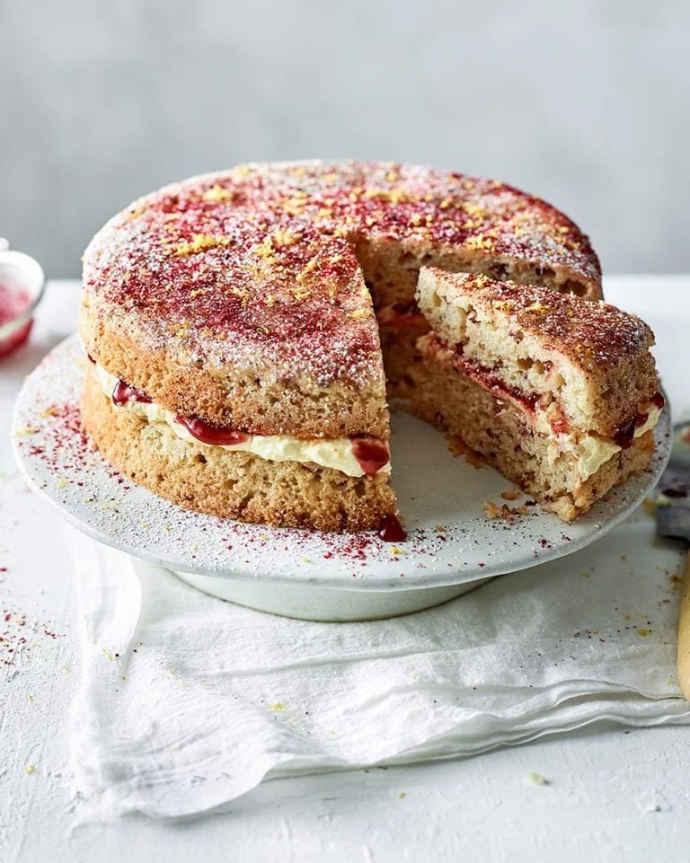 Delicious Vegan Victoria Sponge Cake with fresh berries and cream filling
