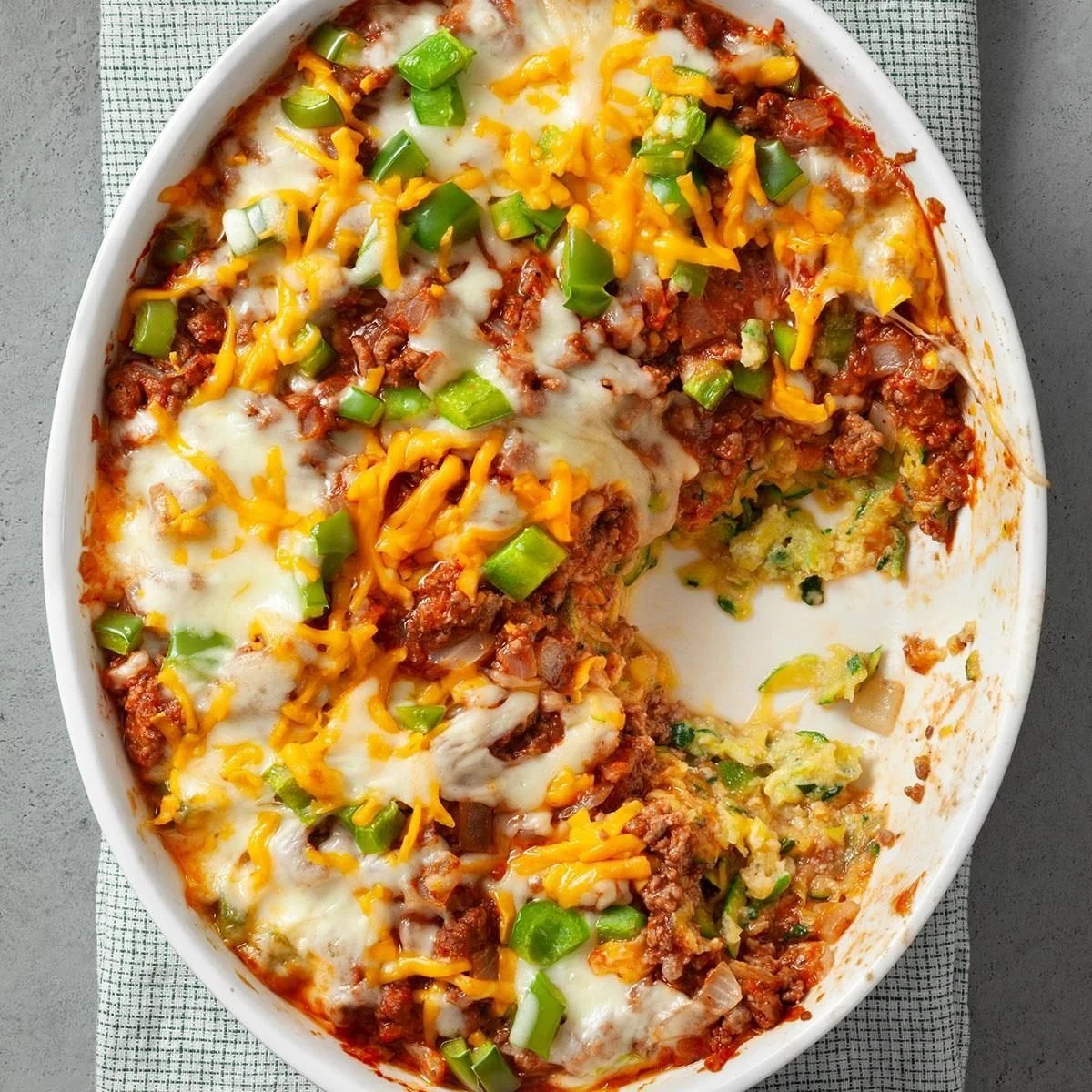 Delicious Zucchini Pizza Casserole fresh out of the oven, topped with cheese and herbs.