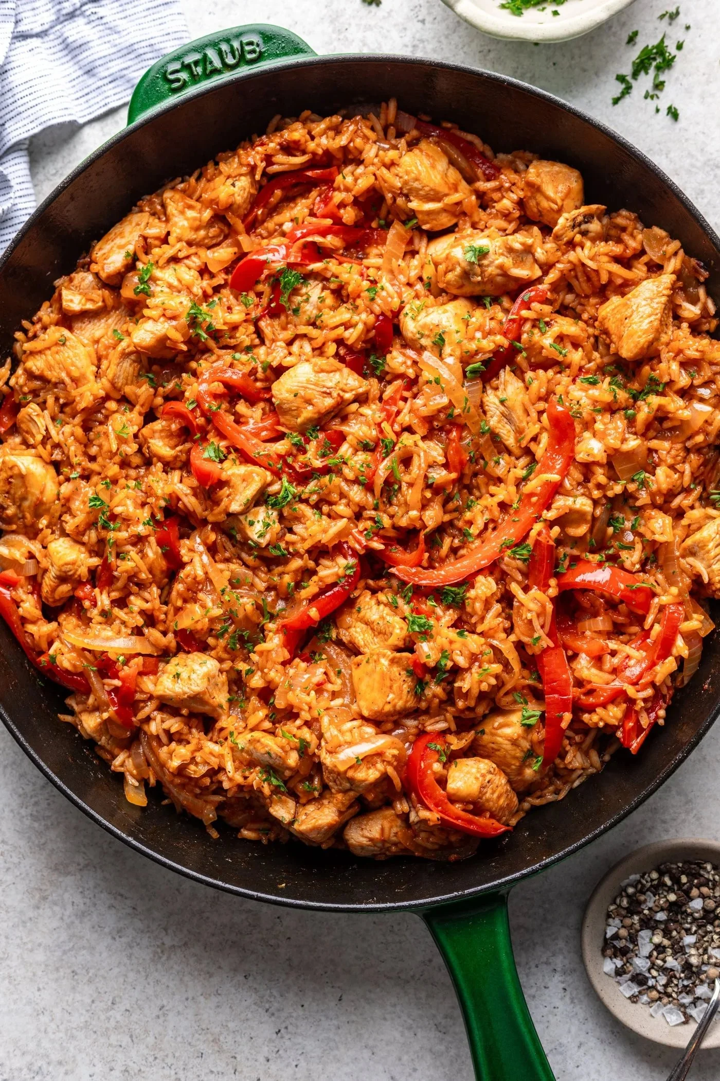 One pan chicken and rice dish cooked in 30 minutes, featuring seasoned chicken and fluffy rice.