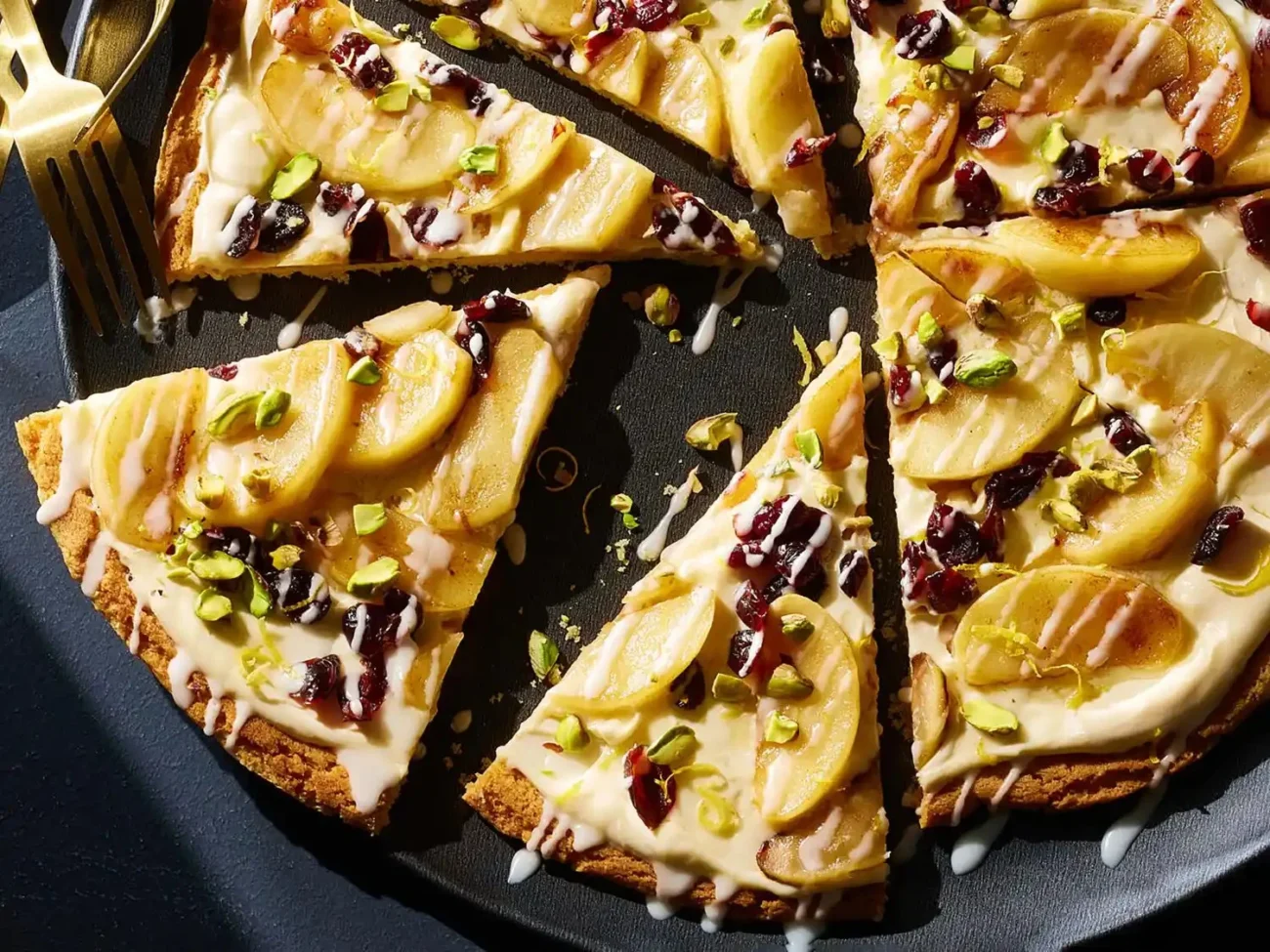 Delicious apple dessert pizza topped with sweet apples and cinnamon.