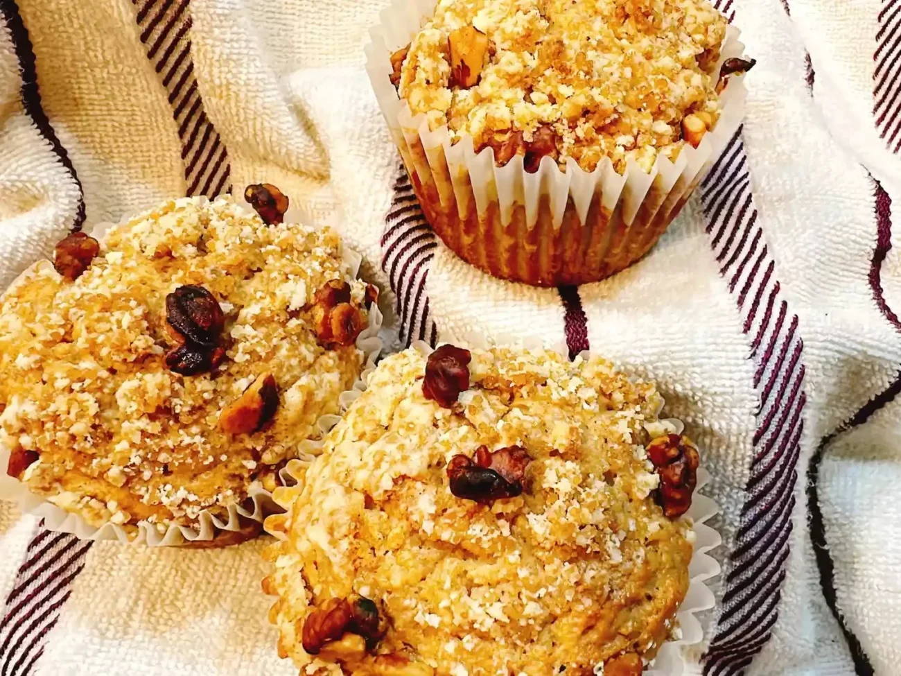 Freshly baked applesauce muffins cooling on a rack