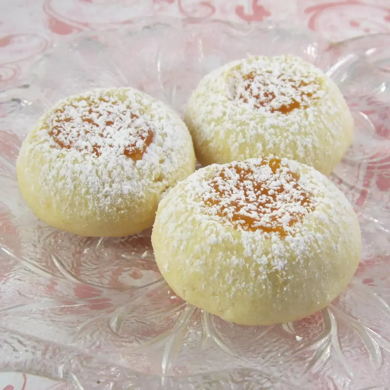 Apricot cream cheese thumbprints cookies on a plate
