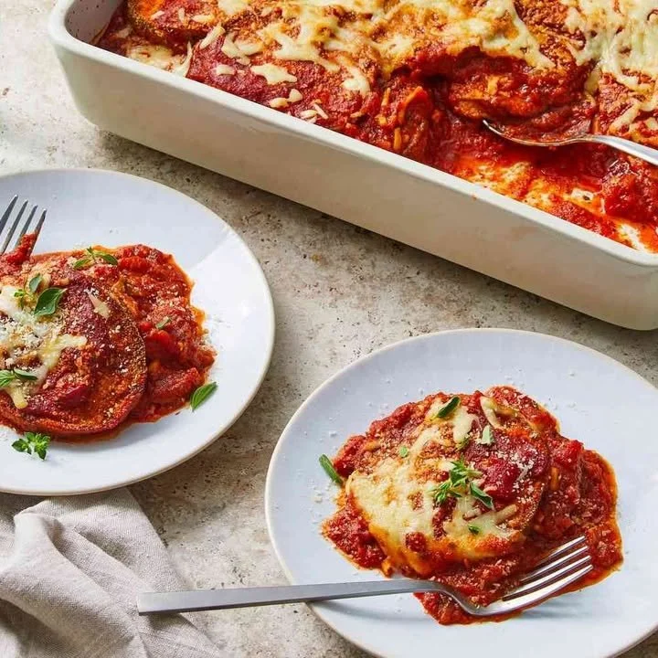 Delicious baked eggplant parmesan layered with cheese and tomato sauce