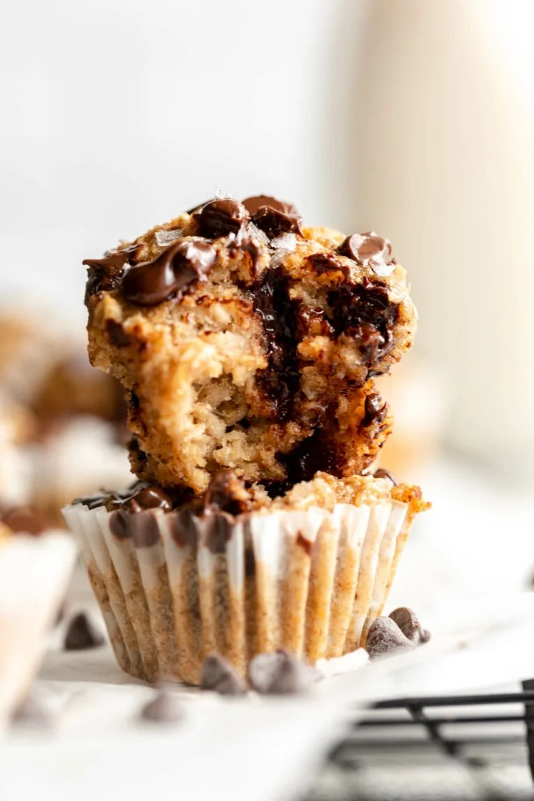 Delicious Banana Chocolate Chip Baked Oatmeal Cups served on a rustic wooden table.