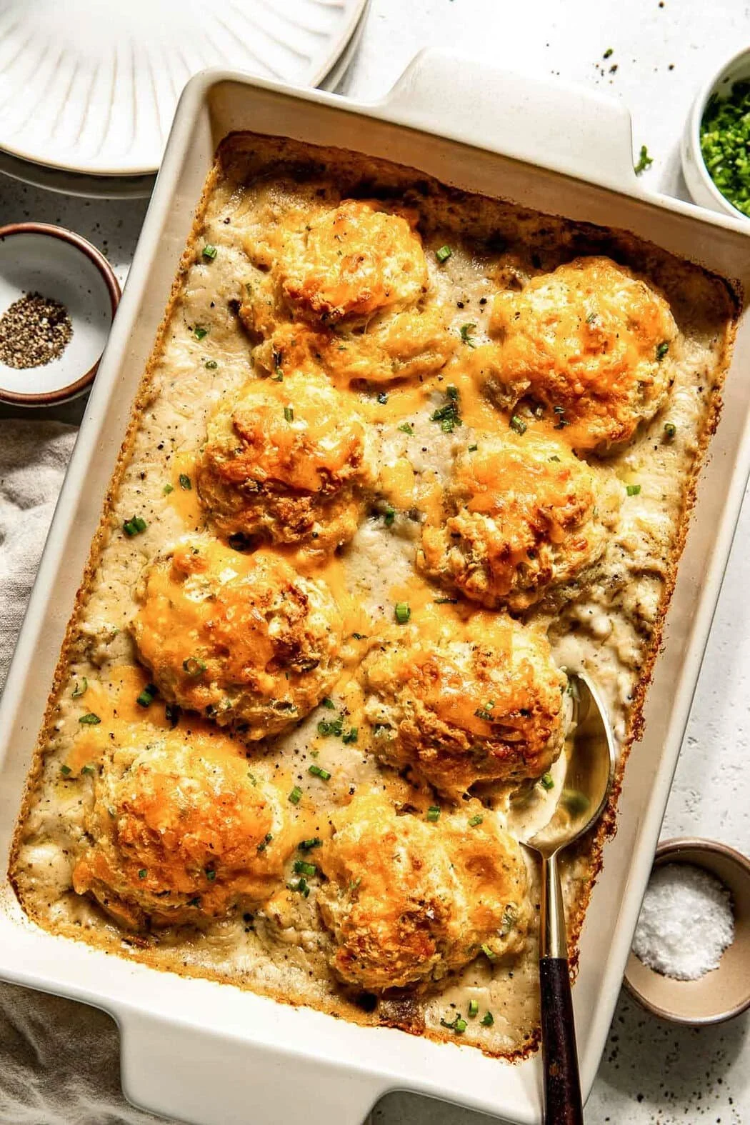 Biscuits and Gravy Casserole with sausage and gravy topping