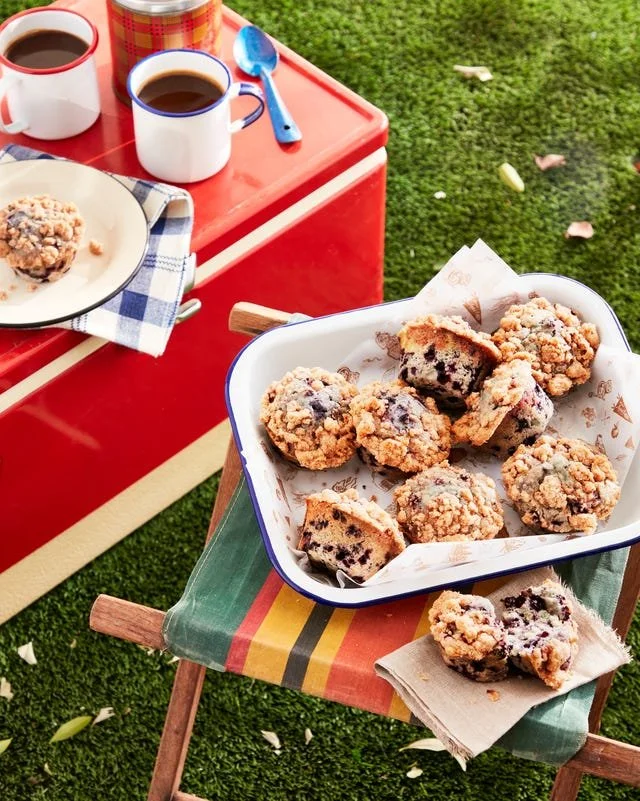 Freshly baked blueberry buckle muffins with crumbly topping
